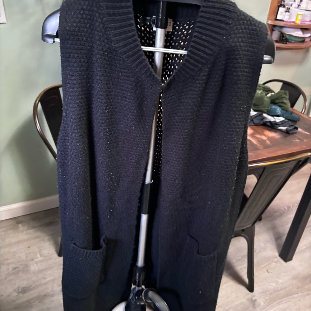 Black sweater vest, fits size large
